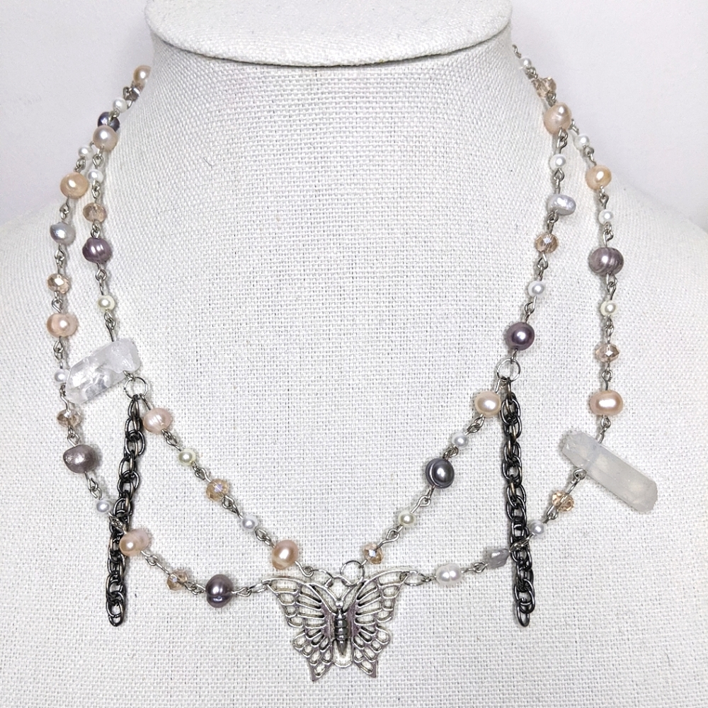 Necklace with pearl and glass beads chain and a butterfly charm. Handmade by me.